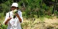 Our happy VR owner harvesting a delicious zucchini